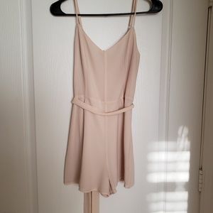 Cream romper with adjustable straps